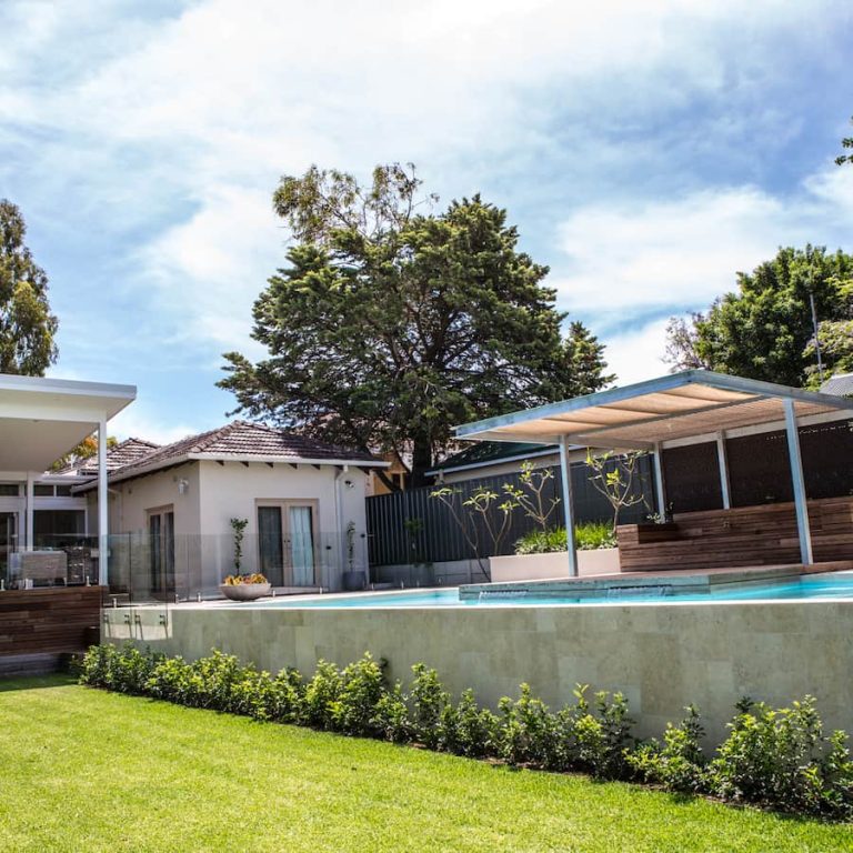 Perth home with elevated pool and retaining walls, areas often assessed during a structural inspection.