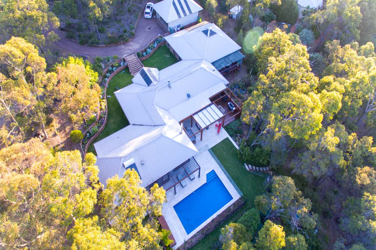Aerial view of a Perth home extension featuring multiple living areas, outdoor entertainment space, and pool.