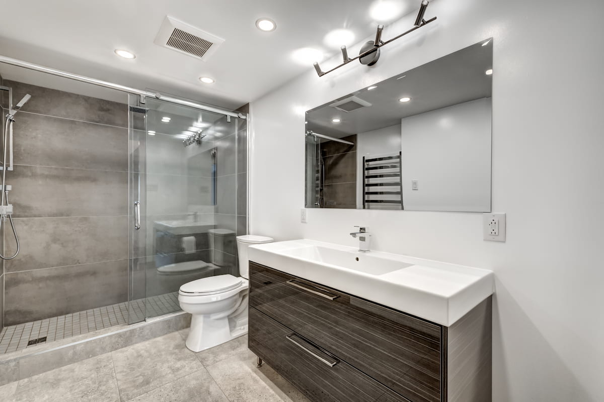 Minimalist bathroom renovation with walk-in shower and modern fittings designed for easy, everyday living.
