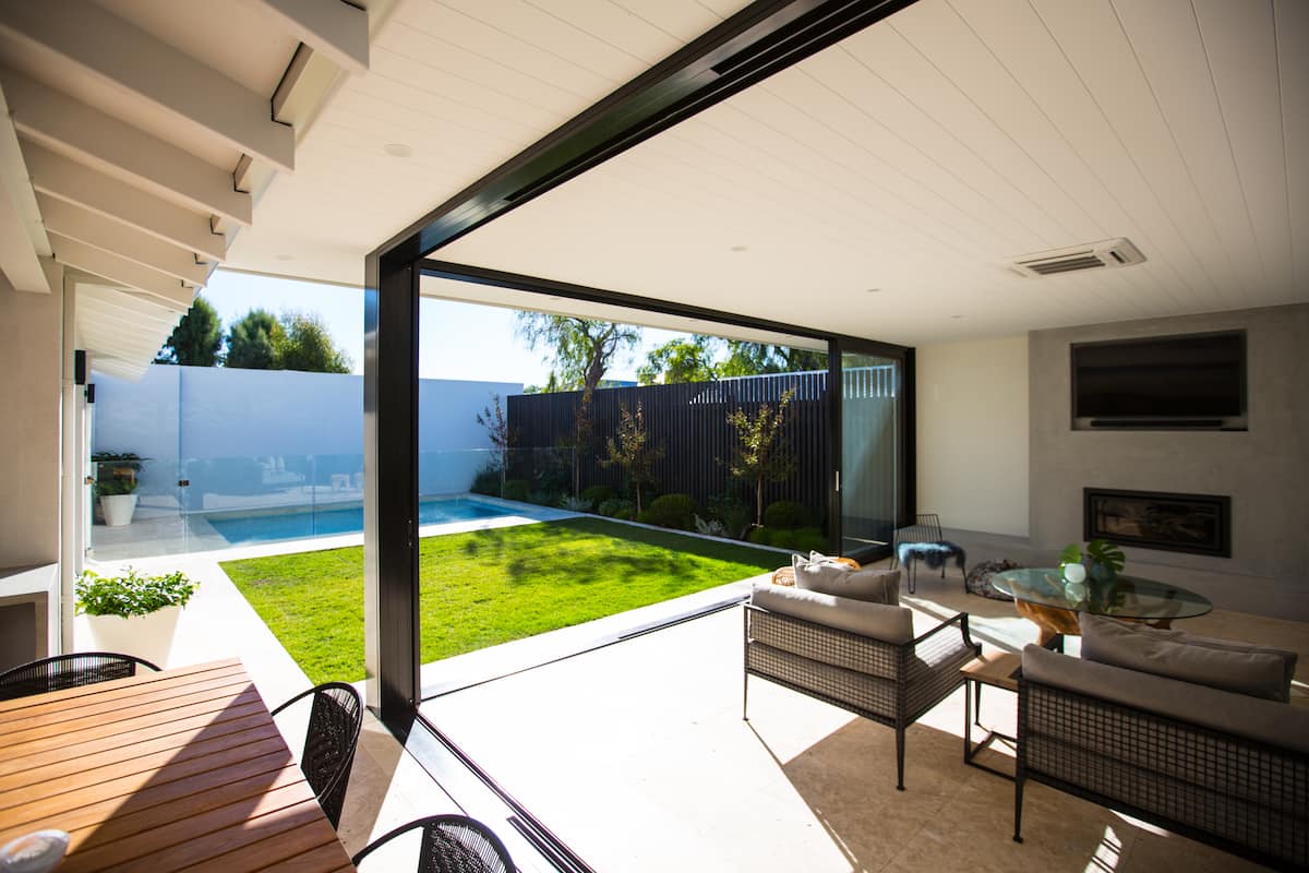 Small home extension in Perth featuring open-plan living and alfresco area designed by Seabreeze.